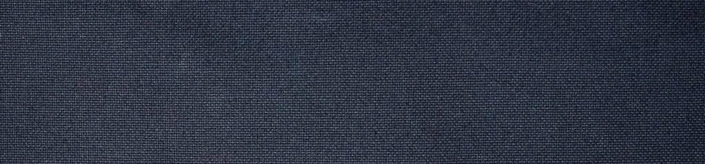 Best sling bag canvas close-up showcasing dark blue, textured fabric with intricate weave details.