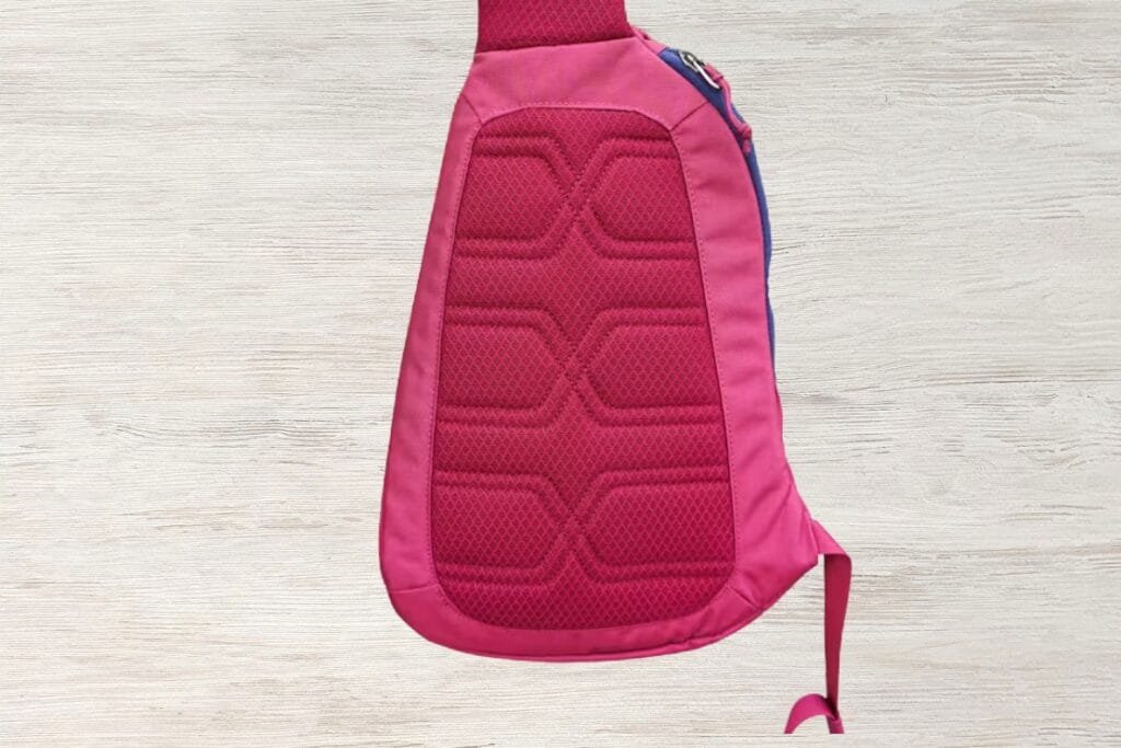 Best sling bag Patagonia Atom pink quilted design with hexagonal pattern and contrasting strap detail.