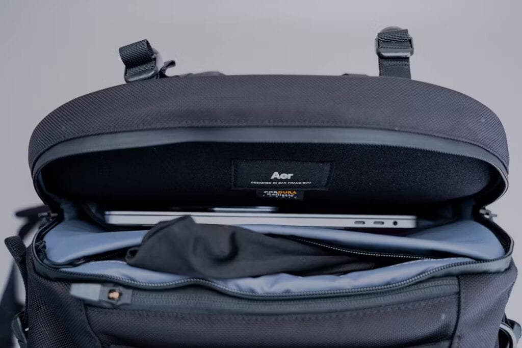 Best travel backpack showing Acer laptop in padded sleeve with spacious interior for protection.