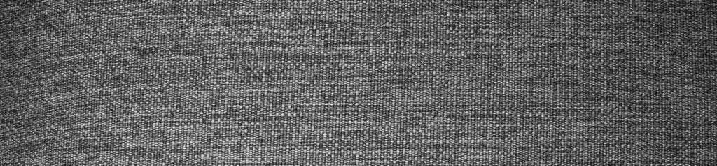 Best travel backpack close-up of gray woven fabric texture with subtle sheen and intricate pattern.