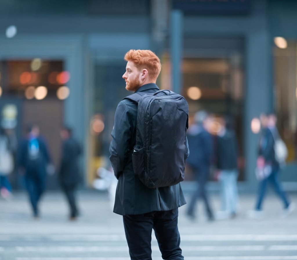 Best Travel Backpack Tortuga Pro 40L showcased in an urban setting with shopper and storefronts.