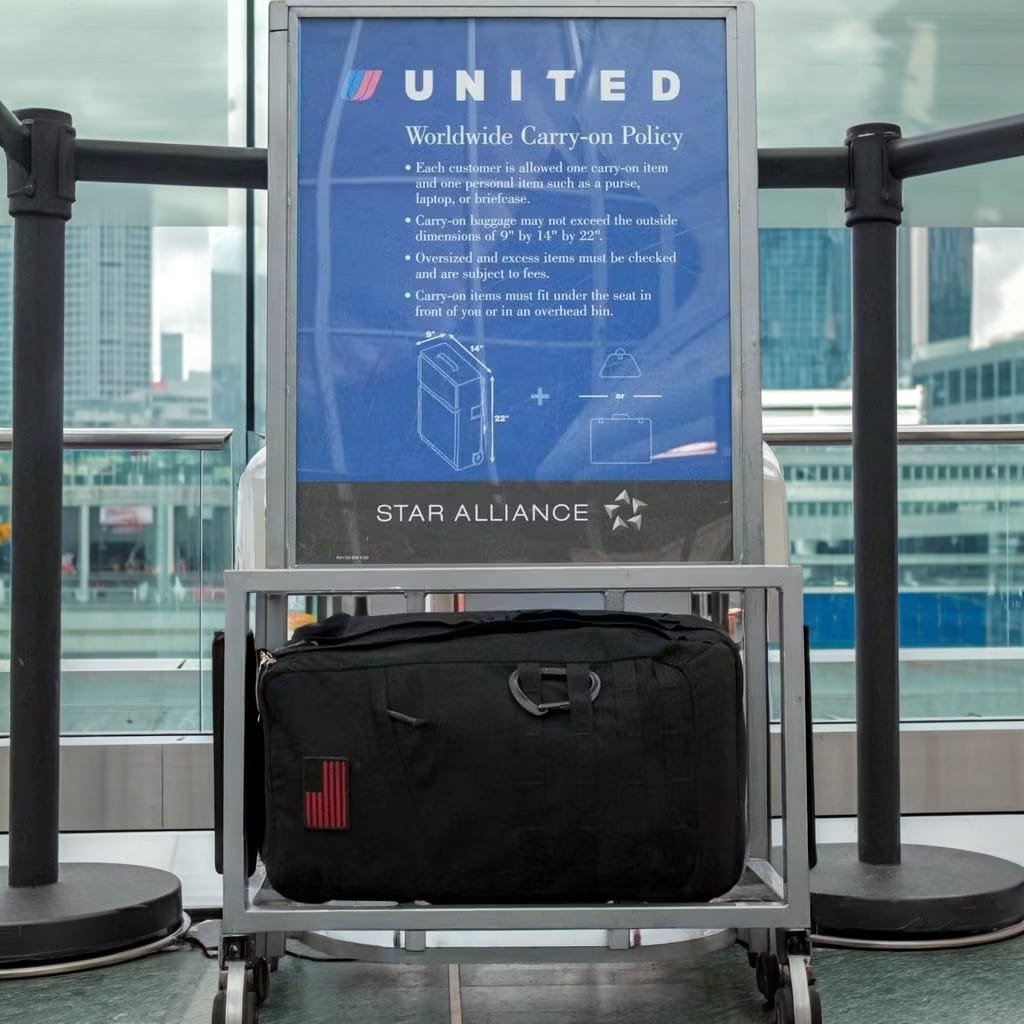 Goruck GR2 40L carry-on demonstration in airport compliance station with Uniteds luggage sizer guidelines.