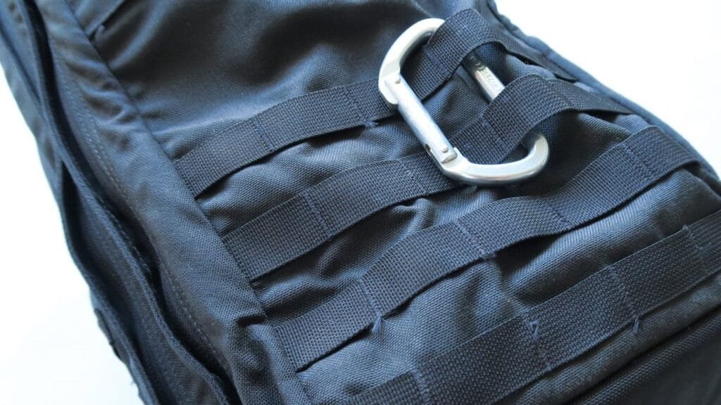 Goruck Gr2 40L tactical backpack with MOLLE system, durable fabric, and aluminum carabiner for versatile use.