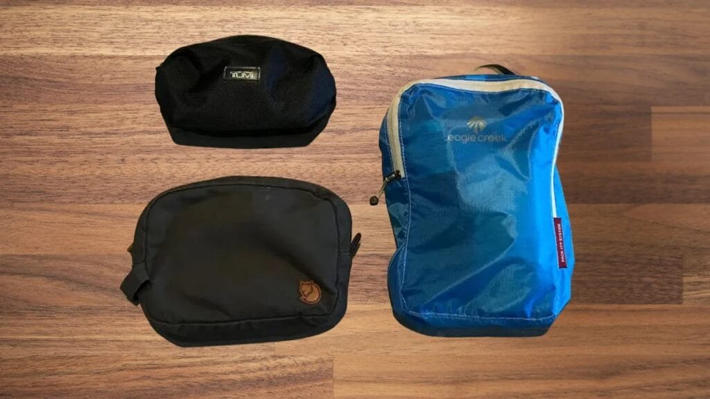 Goruck GR2 pouches trio on wooden background showcasing size, color variations, and branding details.