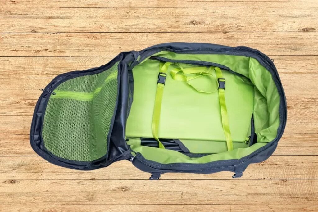 Osprey Farpoint 40 spacious backpack with secure laptop compartment and vibrant lime green interior design.