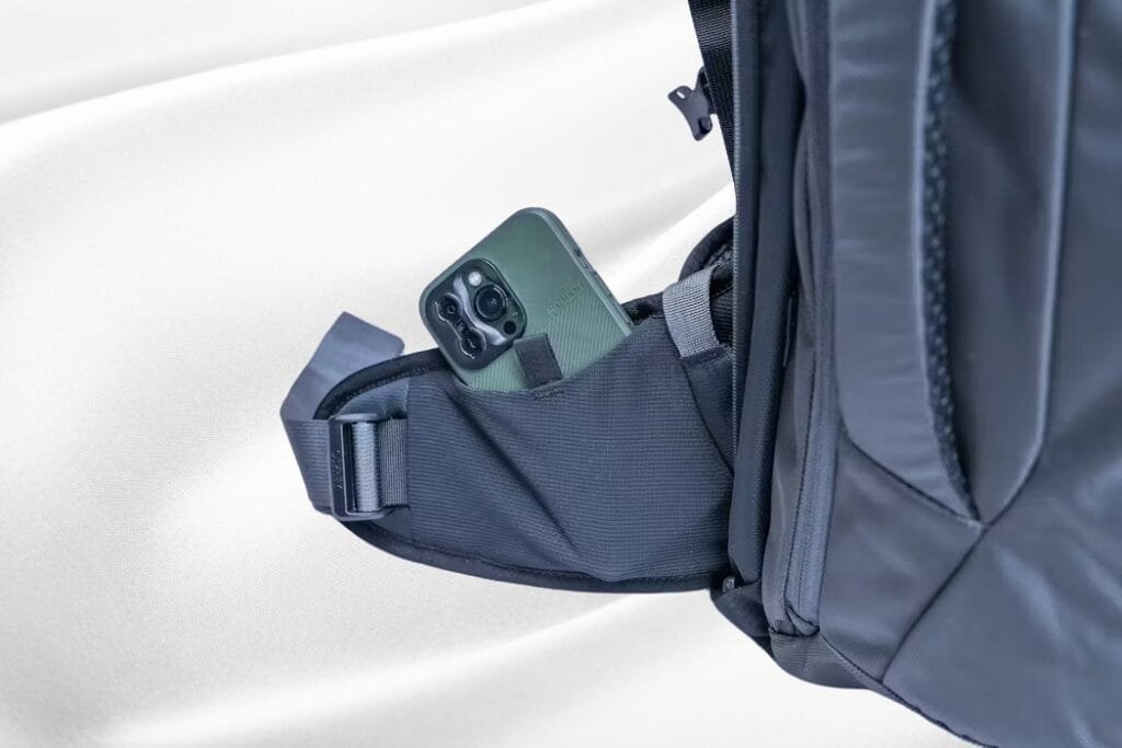 Osprey Farpoint 40 smartphone pocket detail showcasing durable fabric and sleek, modern design.