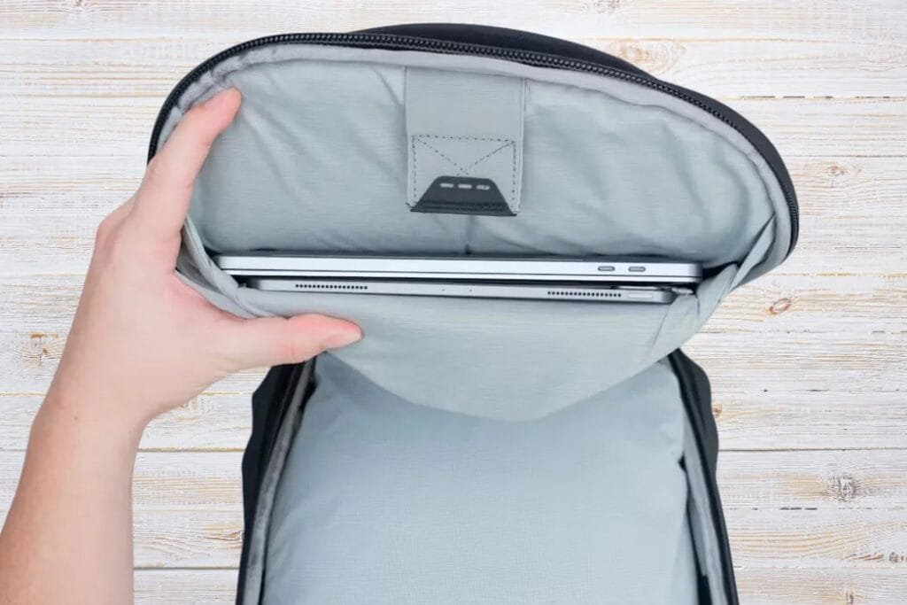 Peak Design Travel Backpack 30L open laptop compartment showcasing sleek padding and silver MacBook Pro.
